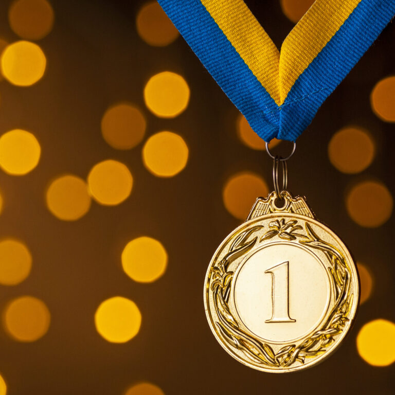 Gold champion or winners medallion on a ribbon